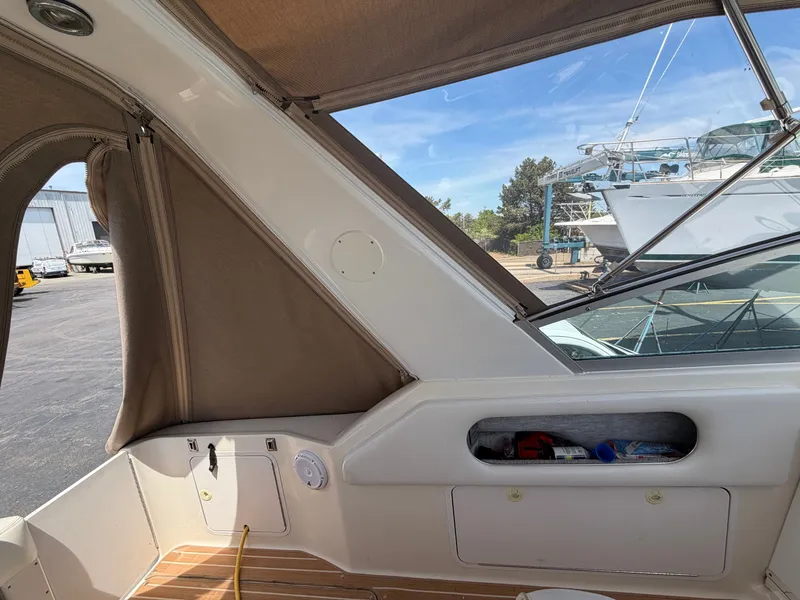 Slide: The Image of Interior of a 1996 Sea Ray 290 Sundancer with wood deck. - 10