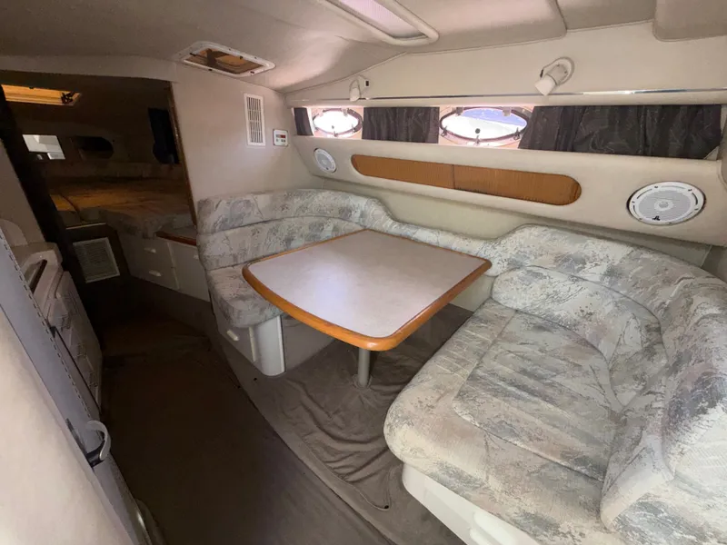 Slide: The Image of Interior of 1996 Sea Ray 290 Sundancer with cozy seating area. - 16