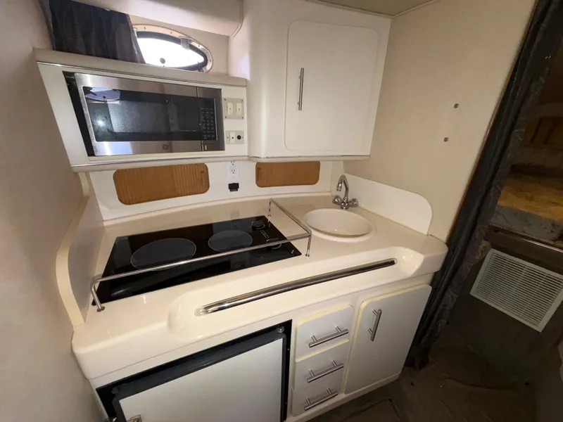 Slide: The Image of Galley in a 1996 Sea Ray 290 Sundancer yacht. - 17
