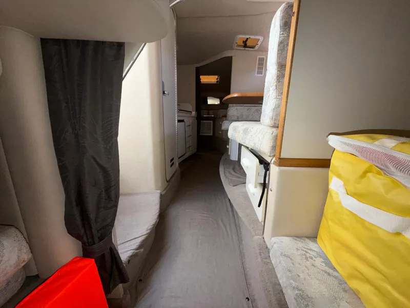 Slide: The Image of Interior of a 1996 Sea Ray 290 Sundancer yacht, cozy and well-equipped. - 23