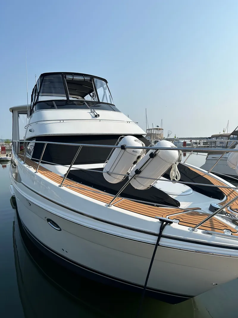 Slide: The Image of 2004 Carver 396 Motor Yacht docked, sleek design. - 3