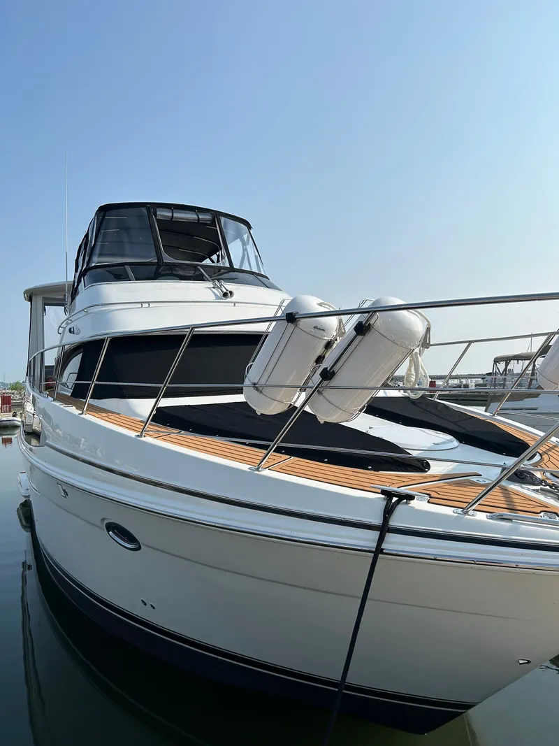 Slide: The Image of 2004 Carver 396 Motor Yacht docked, sleek design. - 4