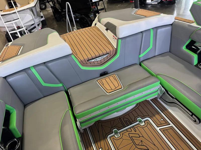 Slide: The Image of Interior of 2019 Nautique Super Air Nautique G21 with gray and green seating. - 16