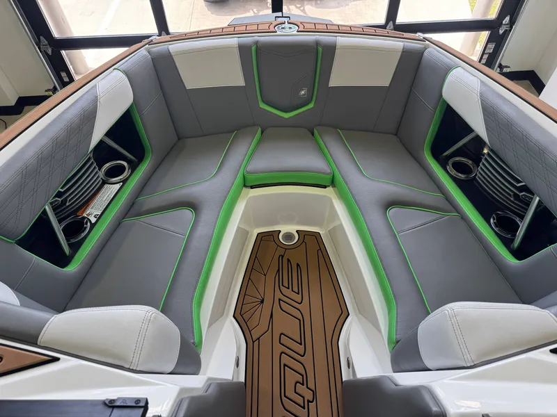 Slide: The Image of Interior of 2019 Nautique Super Air Nautique G21 with gray and green seating. - 17