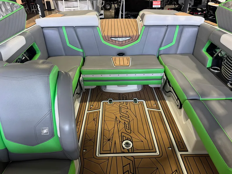 Slide: The Image of Interior of 2019 Nautique Super Air Nautique G21 with green accents. - 22