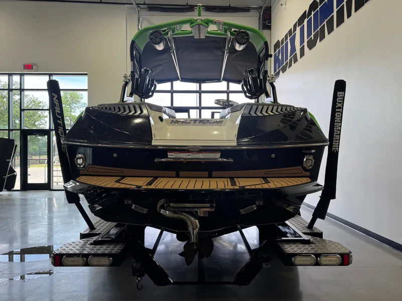 Slide: The Image of 2019 Nautique Super Air Nautique G21 in a showroom. - 6