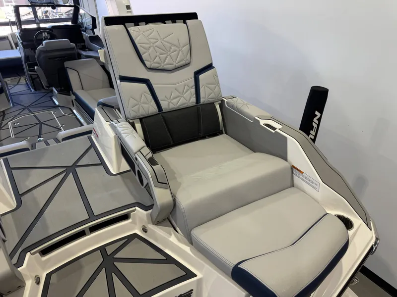 Slide: The Image of Luxurious seating area in 2024 Nautique Super Air G25 Paragon boat. - 14