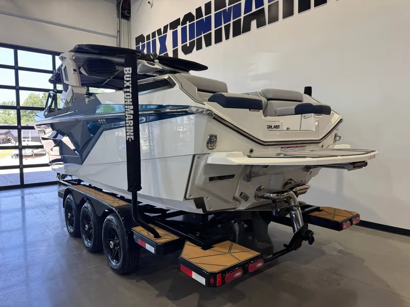 Slide: The Image of 2024 Nautique Super Air Nautique G25 Paragon on trailer in showroom. - 5