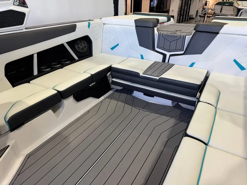 Slide: The Image of The image shows the interior of a modern boat with stylish seating and sleek flooring. - 15