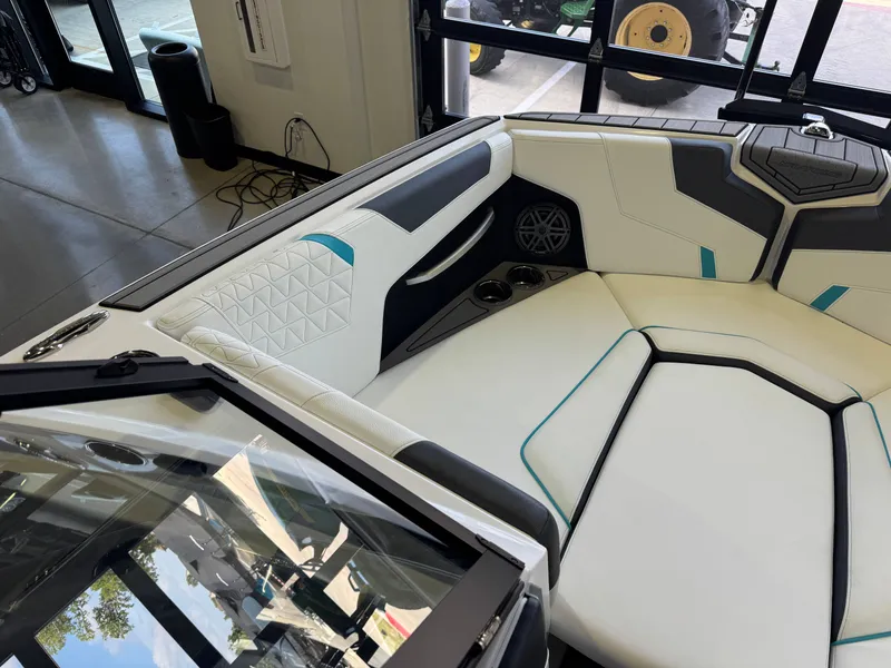 Slide: The Image of Interior of a modern boat with white upholstery and blue accents. - 19