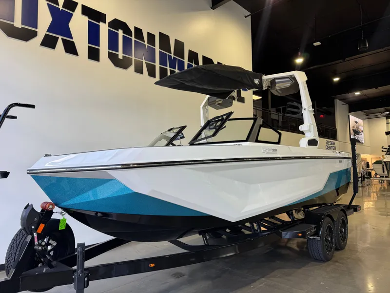 Slide: The Image of 2026 Nautique Super Air Nautique GS22 in a showroom. - 2