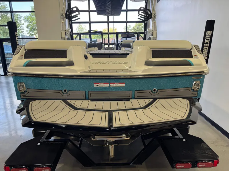 Slide: The Image of The image shows the rear of a 2026 Nautique Super Air Nautique GS22 boat. - 8