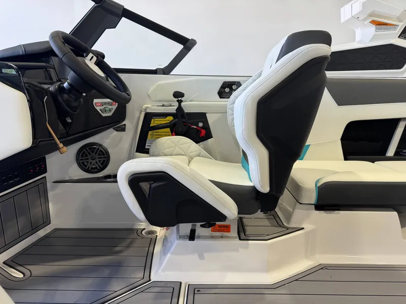 Slide: The Image of Interior view of a modern boat with white and black seats, steering wheel, and control console. - 23