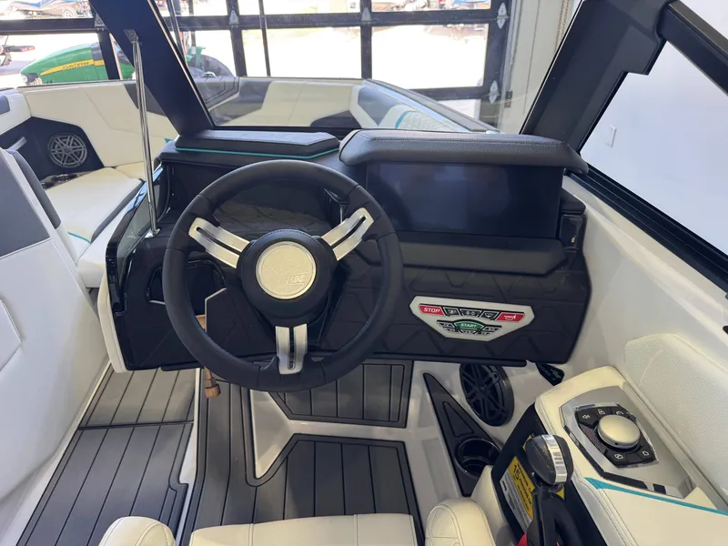 Slide: The Image of Interior view of a modern boat with steering wheel and controls. - 26