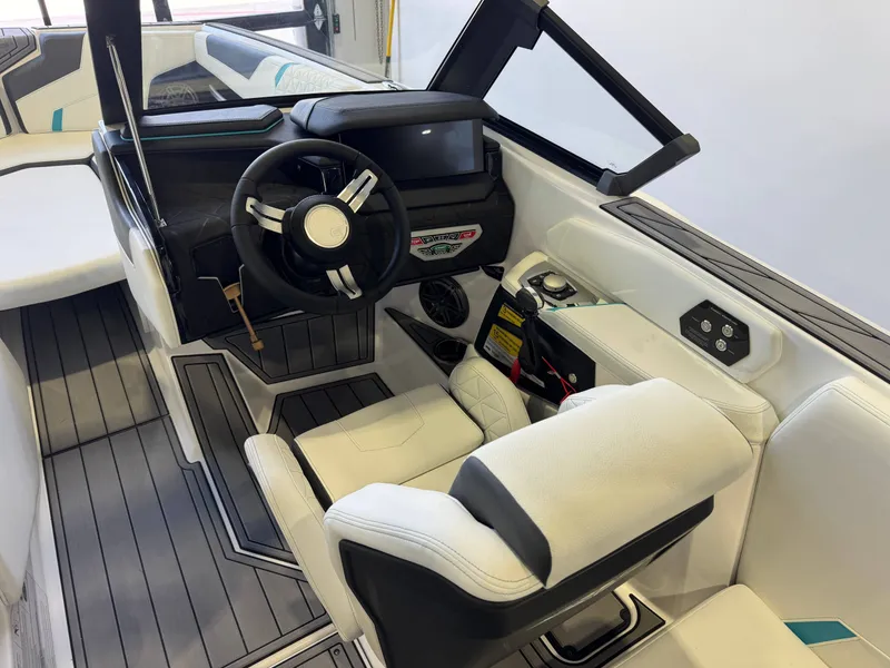 Slide: The Image of Interior view of a modern boat with white seating and steering wheel. - 25