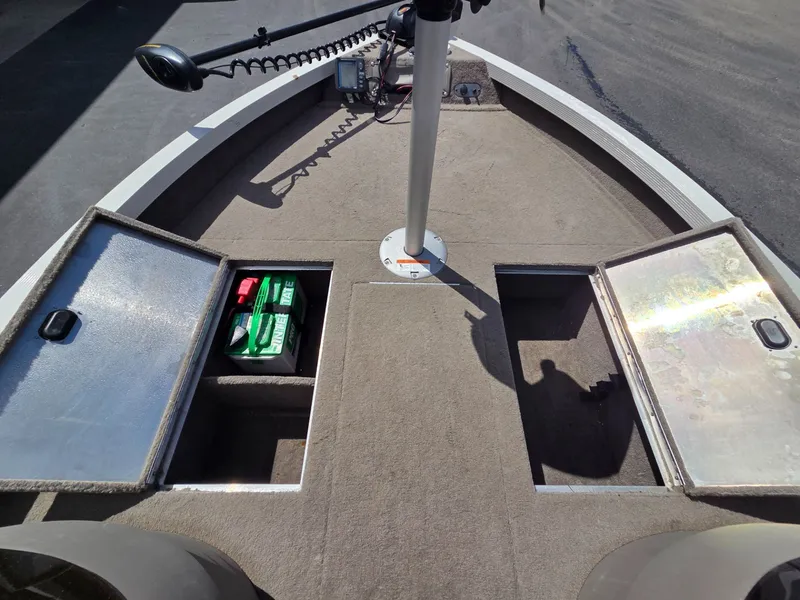 Slide: The Image of 2004 Crestliner CMV 1750 boat with open storage compartments. - 15