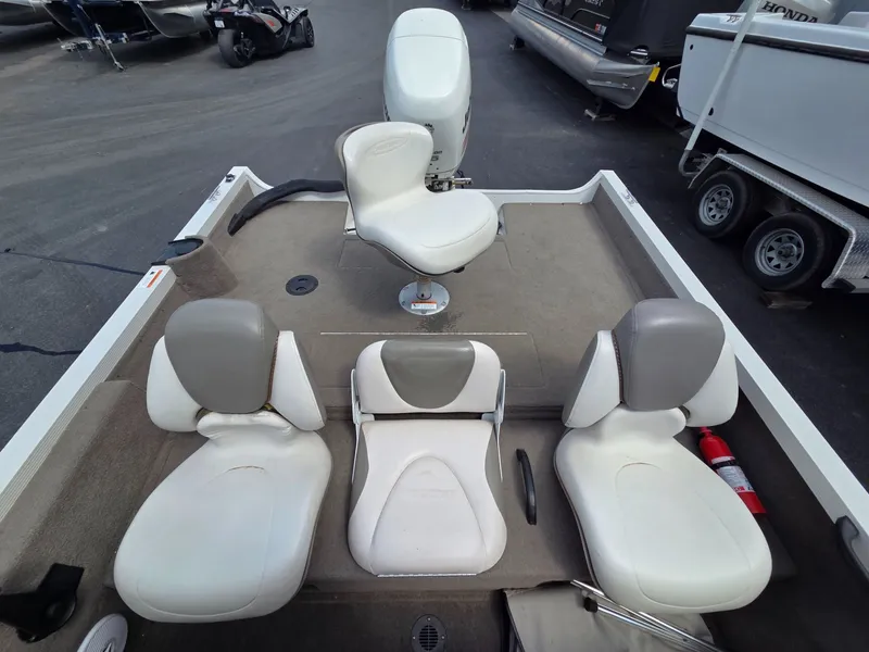 Slide: The Image of Interior of a 2004 Crestliner CMV 1750 with four seats. - 20