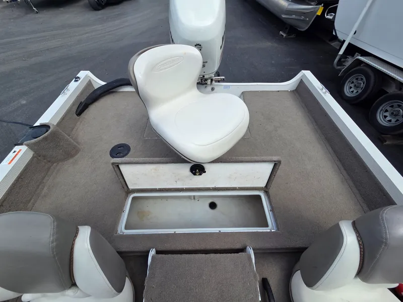 Slide: The Image of Interior of a 2004 Crestliner CMV 1750 boat with seating and storage. - 22