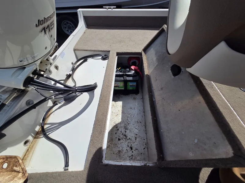 Slide: The Image of Crestliner CMV 1750 boat with Johnson 115 engine and battery, year 2004. - 23