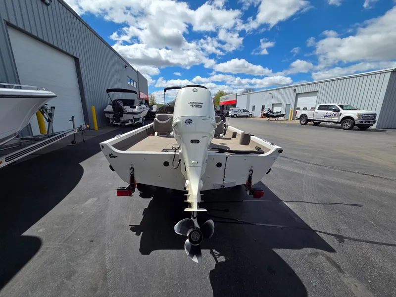Slide: The Image of 2004 Crestliner CMV 1750 boat with outboard motor in parking lot. - 7