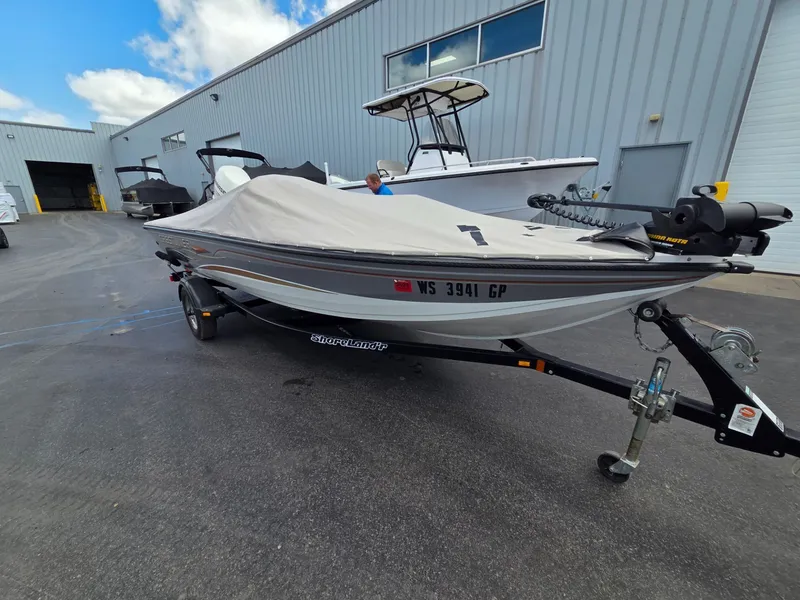 Slide: The Image of 2004 Crestliner CMV 1750 boat with cover on trailer. - 9