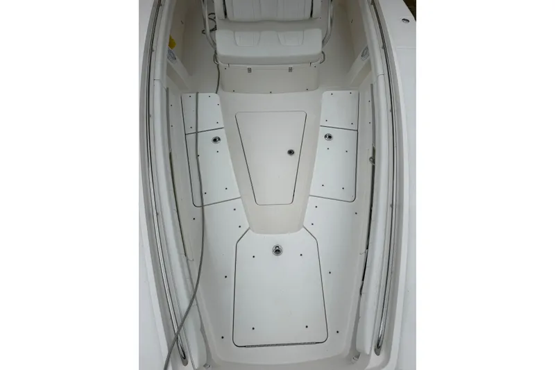 Slide: The Image of 2018 Regulator 31 boat deck with storage compartments and seating area. - 10