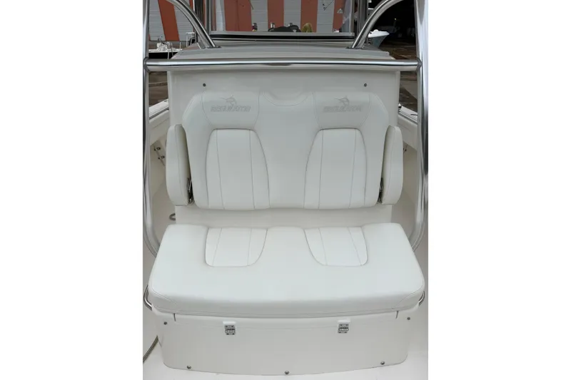 Slide: The Image of 2018 Regulator 31 boat seat with white upholstery and embossed logo. - 12