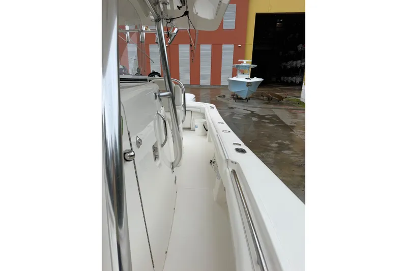 Slide: The Image of 2018 Regulator 31 boat interior with sleek design and stainless steel features. - 14