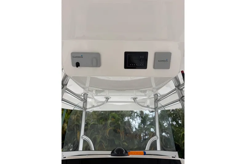 Slide: The Image of 2018 Regulator 31 boat console with Garmin electronics and canopy. - 19
