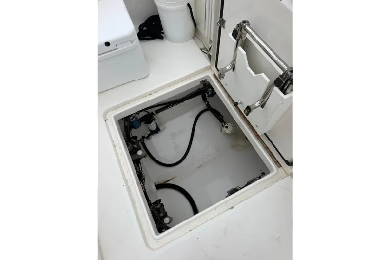 Slide: The Image of Open hatch of a 2018 Regulator 31 boat showing internal components and wiring. - 21