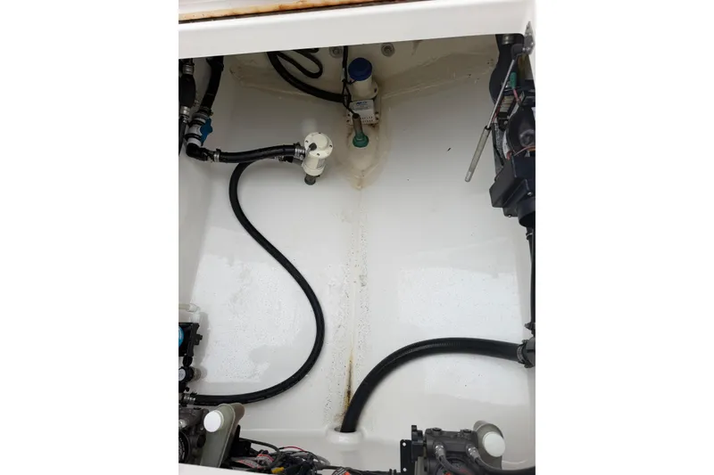Slide: The Image of 2018 Regulator 31 boat interior showing engine compartment and wiring. - 22
