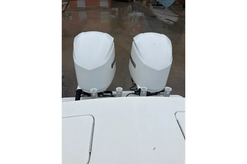 Slide: The Image of Twin outboard engines on a 2018 Regulator 31 boat, viewed from above. - 24