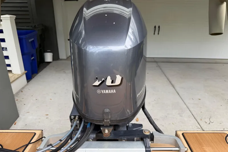 Slide: The Image of Yamaha outboard motor on 2018 Cast and Blast 17CC boat in garage. - 10