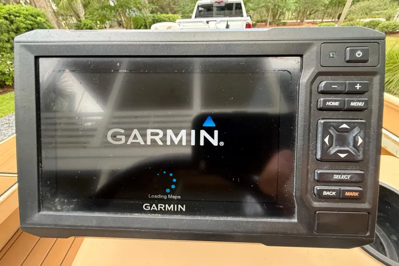 Slide: The Image of Garmin GPS device on 2018 Cast and Blast 17CC boat, displaying loading maps screen. - 12