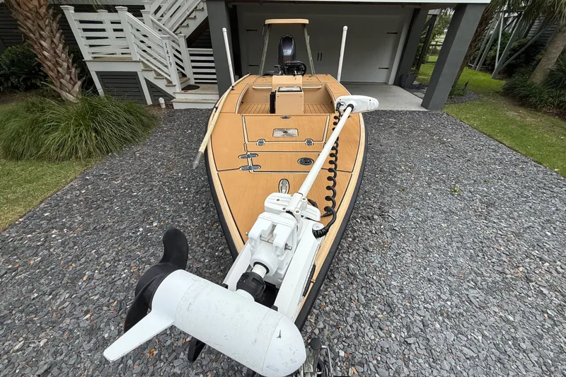 Slide: The Image of 2018 Cast and Blast 17CC boat with trolling motor on gravel driveway. - 5