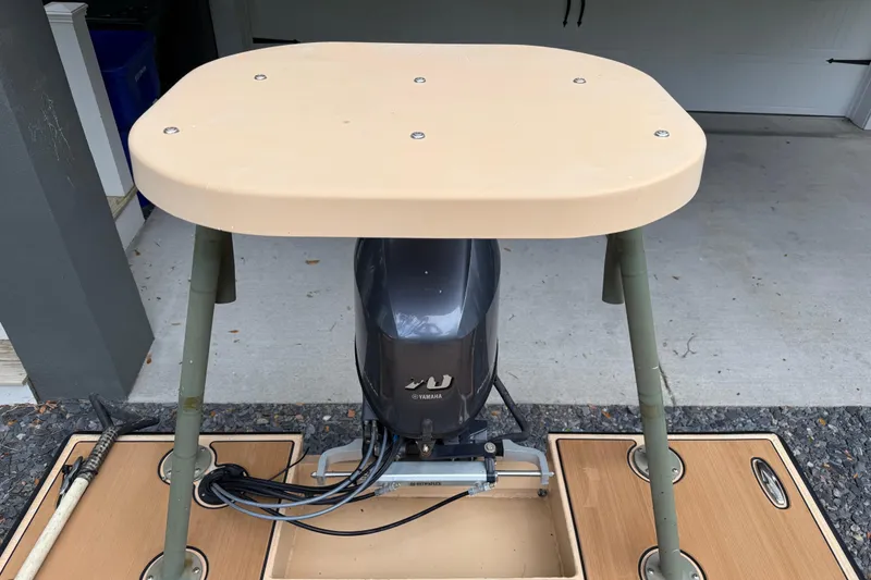 Slide: The Image of 2018 Cast and Blast 17CC boat with Yamaha motor in a garage setting. - 7