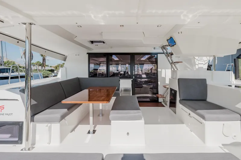 Slide: The Image of Spacious interior of 2020 Fountaine Pajot Saona 47 catamaran with modern seating and dining area. - 2