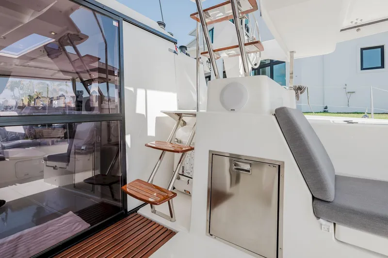 Slide: The Image of 2020 Fountaine Pajot Saona 47 yacht interior with modern seating and wooden steps. - 20