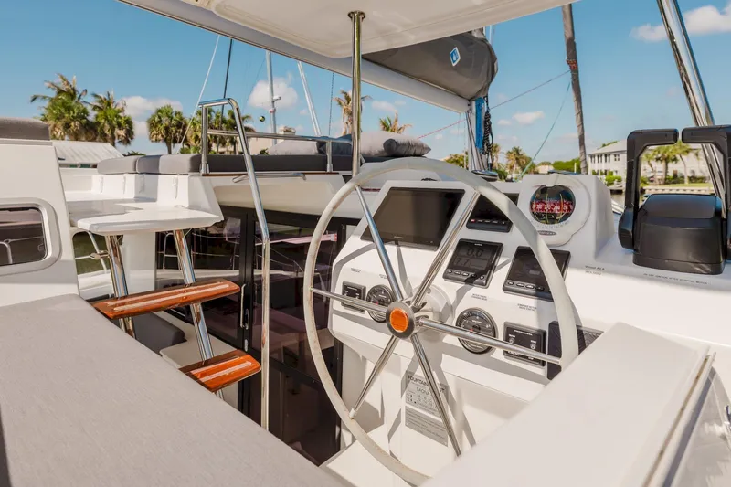 Slide: The Image of Cockpit of 2020 Fountaine Pajot Saona 47 catamaran with steering wheel and navigation instruments. - 21