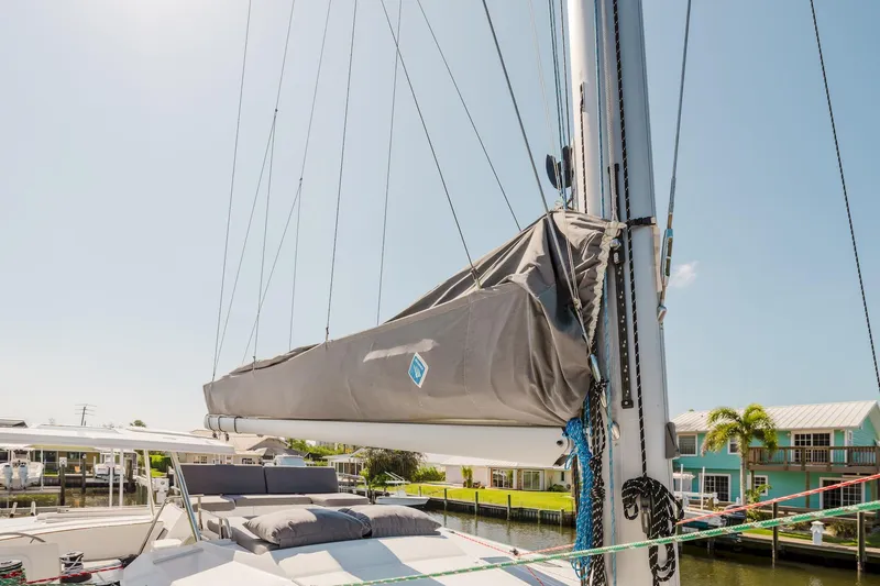 Slide: The Image of Fountaine Pajot Saona 47 sailboat mast and boom, 2020 model, docked in sunny marina. - 27