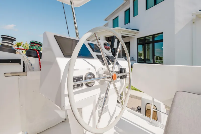 Slide: The Image of Helm of 2020 Fountaine Pajot Saona 47 catamaran with modern navigation instruments. - 3