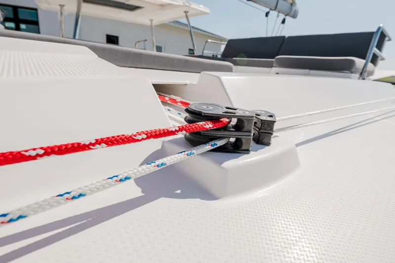 Slide: The Image of Close-up of ropes and cleat on 2020 Fountaine Pajot Saona 47 catamaran deck. - 31