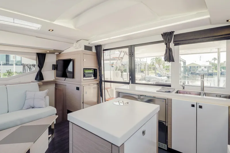 Slide: The Image of Modern interior of 2020 Fountaine Pajot Saona 47 catamaran with sleek kitchen and lounge area. - 35