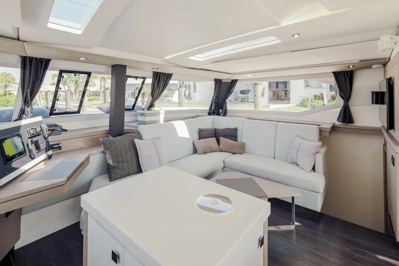 Slide: The Image of Luxurious interior of 2020 Fountaine Pajot Saona 47 catamaran with modern seating and navigation area. - 37