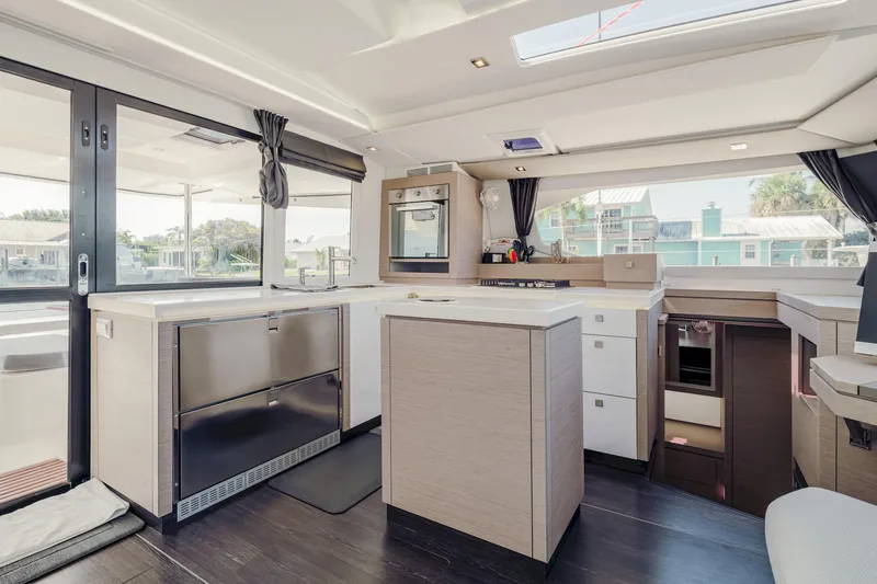 Slide: The Image of Modern kitchen interior of 2020 Fountaine Pajot Saona 47 catamaran, featuring sleek design and ample natural light. - 43