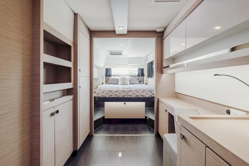 Slide: The Image of Luxurious interior of 2020 Fountaine Pajot Saona 47 catamaran, featuring modern bedroom and cabinetry. - 5