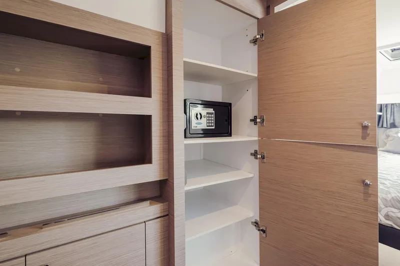 Slide: The Image of Interior of 2020 Fountaine Pajot Saona 47 yacht with open cabinet and safe. - 51