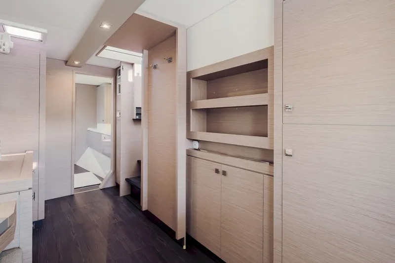 Slide: The Image of Interior of 2020 Fountaine Pajot Saona 47 yacht, featuring modern wood cabinetry and sleek design. - 52