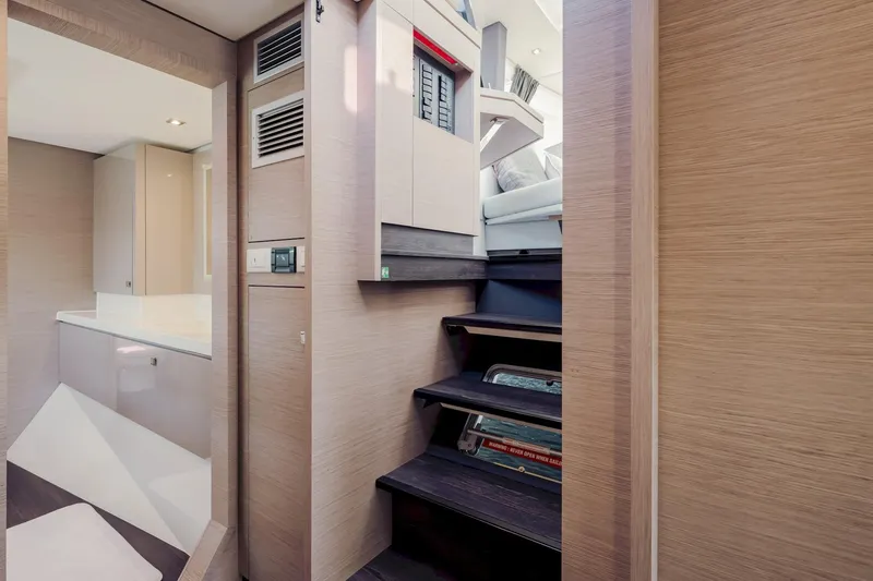 Slide: The Image of Interior of 2020 Fountaine Pajot Saona 47 yacht, featuring modern stairs and sleek design. - 59