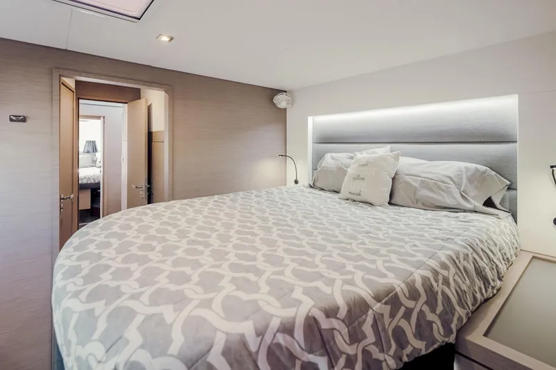 Slide: The Image of Luxurious bedroom interior of 2020 Fountaine Pajot Saona 47 catamaran with modern bedding. - 60